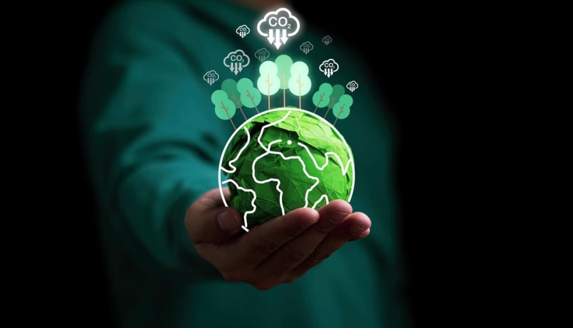 Businessman,Holding,Green,Scrap,Paper,Ball,With,Virtual,World,Trees