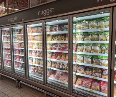 KUALA LUMPUR, MALAYSIA MARCH 16, 2020: Packed Chicken Nugget In Various Brand Placed In Display Chiller Refrigerator Inside The Huge Supermarket.