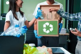 In,An,Office,,An,Asian,Team,Discusses,Waste,Management,Strategies