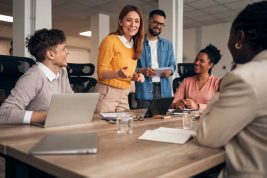 A,Group,Of,Office,Professionals,Engaged,In,A,Lively,Discussion