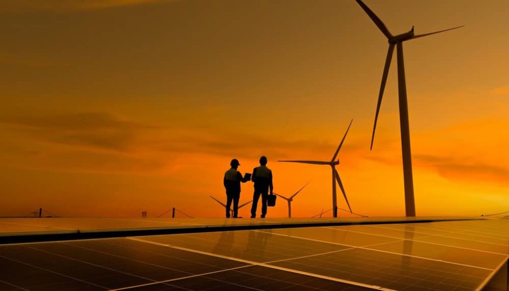 Silhouette,Engineer,Working,On,Solar,Cell,Roof,Plant,With,Windmill