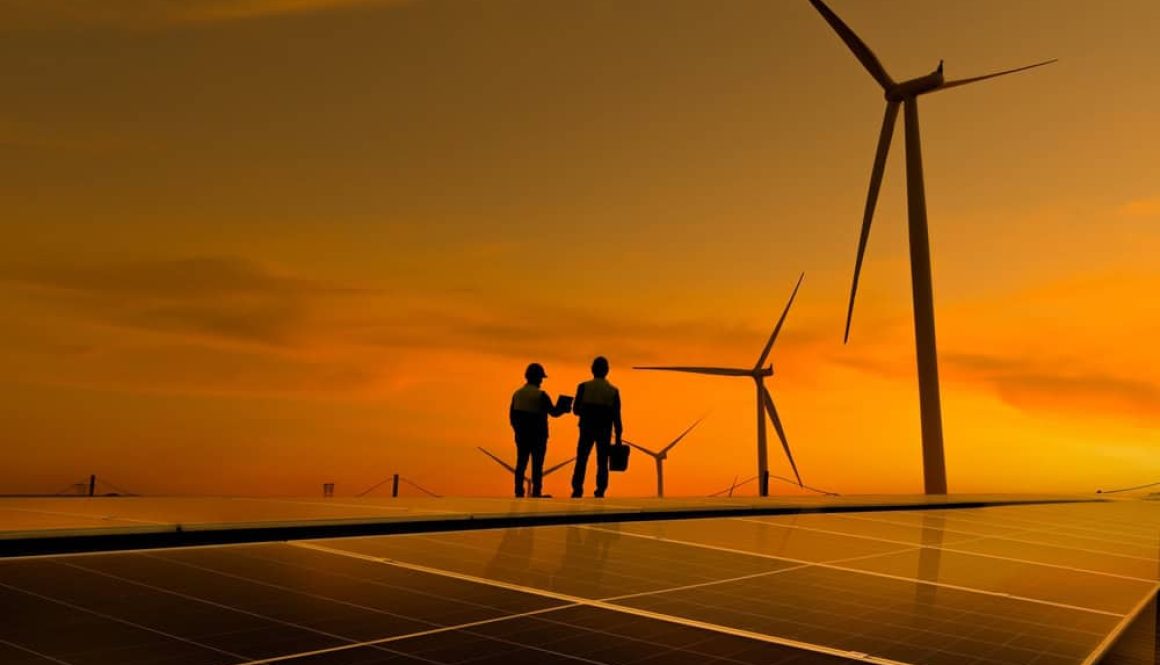 Silhouette,Engineer,Working,On,Solar,Cell,Roof,Plant,With,Windmill