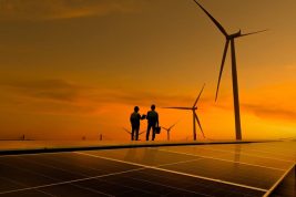 Silhouette,Engineer,Working,On,Solar,Cell,Roof,Plant,With,Windmill