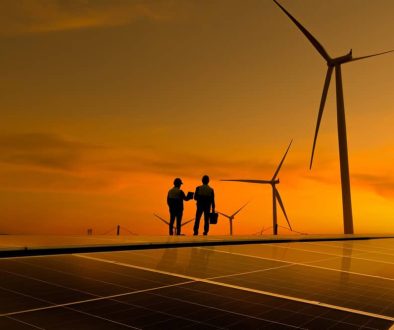Silhouette,Engineer,Working,On,Solar,Cell,Roof,Plant,With,Windmill