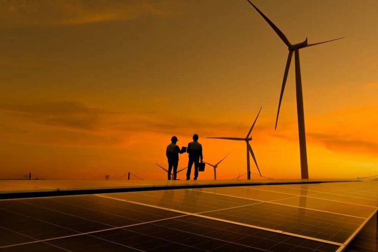 Silhouette,Engineer,Working,On,Solar,Cell,Roof,Plant,With,Windmill